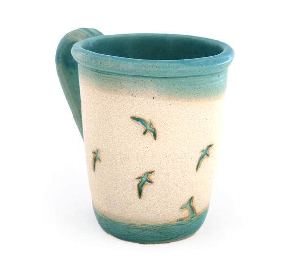 Coastal themed pottery, high fired stoneware mug with a hand etched design of gulls diving into the water