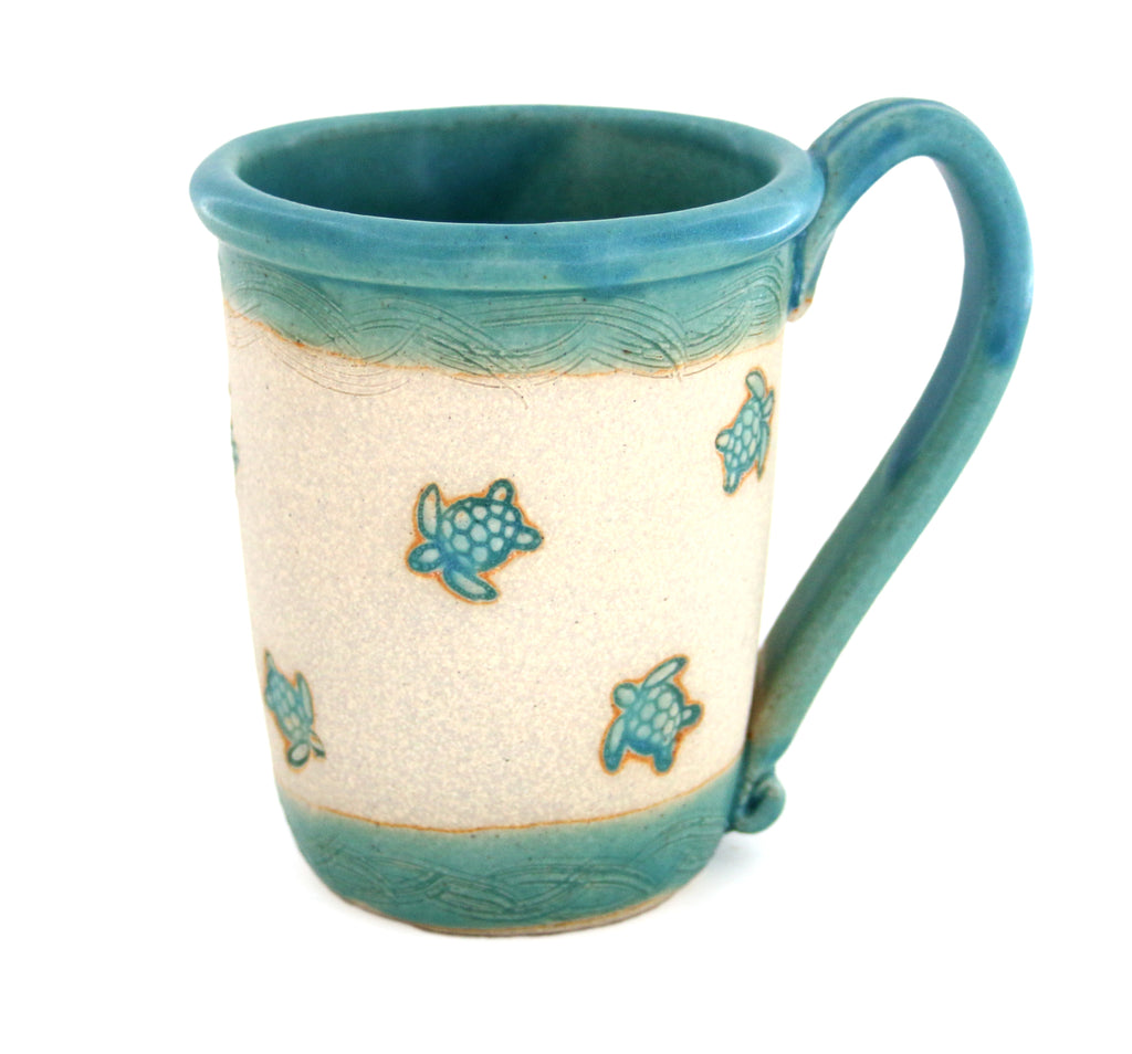 Coastal themed pottery, high fired stoneware mug with a hand etched design of sea turtles. 