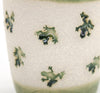 Coastal themed pottery, high fired stoneware mug with a hand etched design of leaping frogs. Close up of artwork