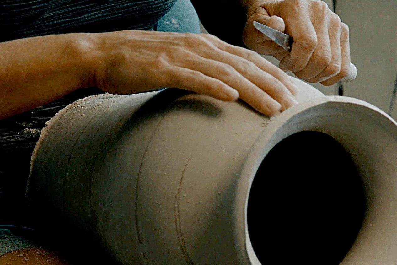 Hand crafted stoneware starts with hand trimming and finishing the clay body before doing its first bisque firing.