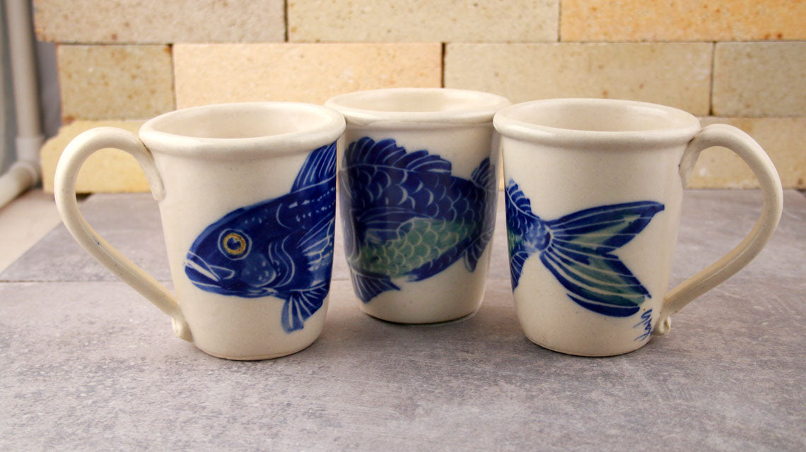 A trio of our Chatham Pottery mugs with our beautiful Handpainted Fish design