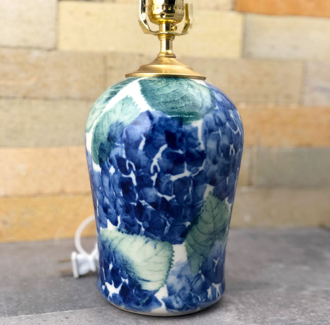 A medium stoneware lamp adorned with our famous Hydrangea Pattern